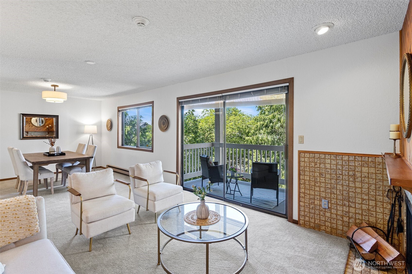 A large Living Room with new carpet throughout and a wood burning fireplace for those cozy evenings. Beautiful woodwork continues throughout the home.