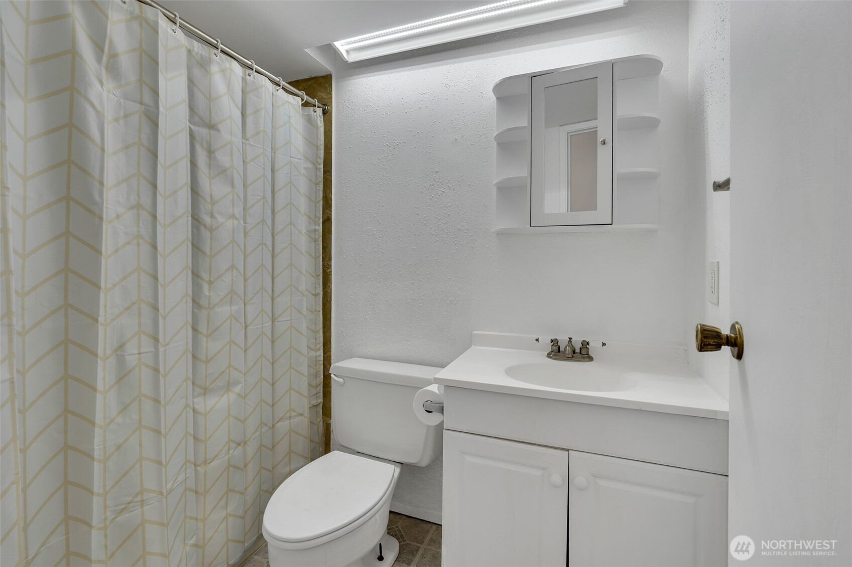 One of two full baths on upper level.