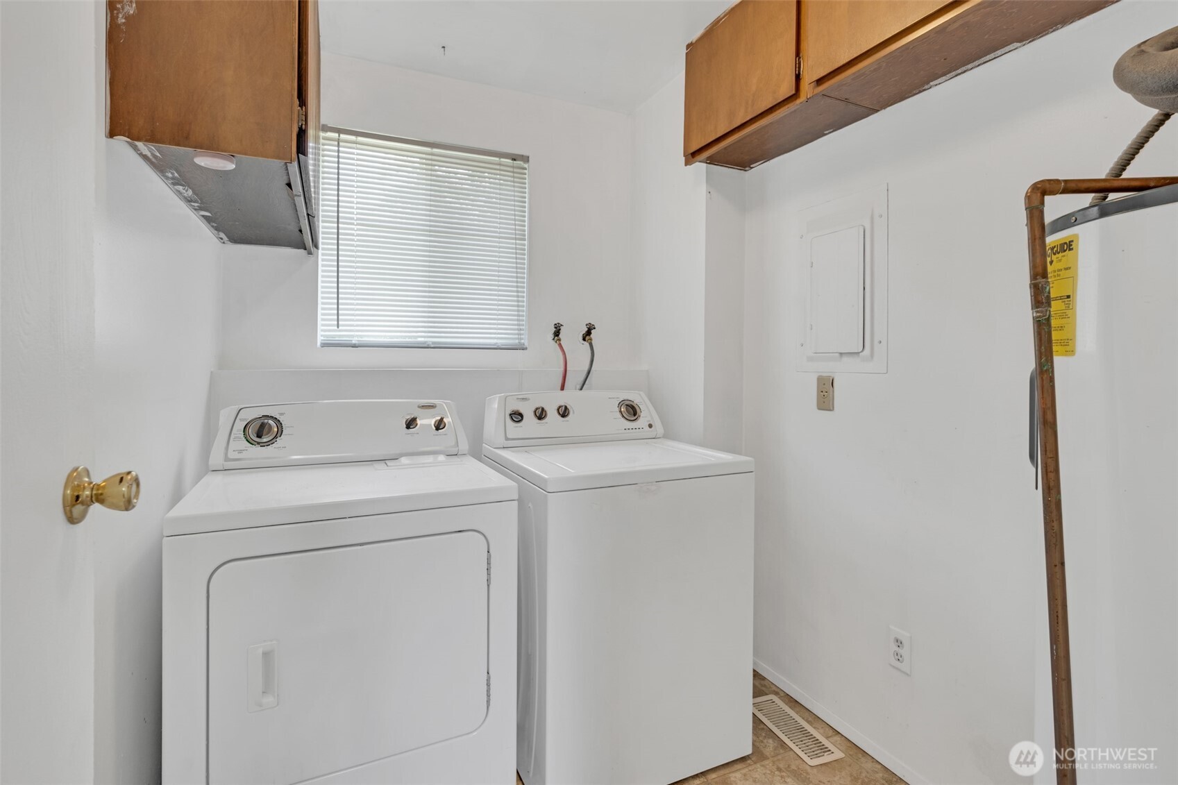 Laundry room offers some extra storage space to keep household items organized.