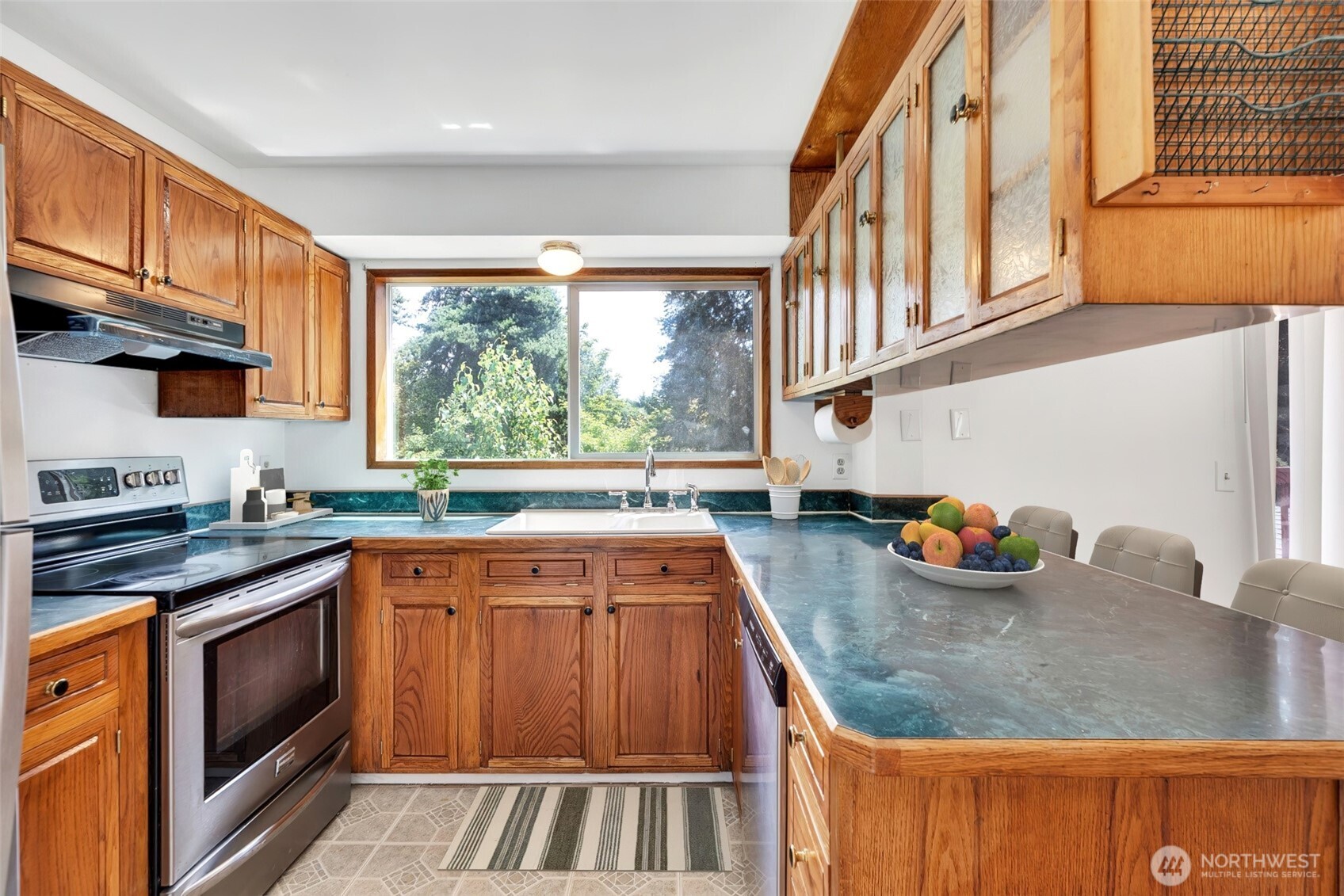 Peninsula counter offers bar seating for busy mornings or snack time.