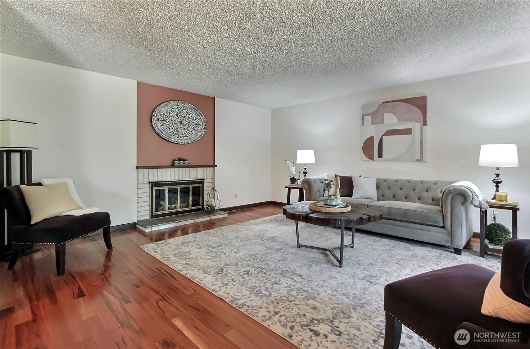 Formal living room with gas fireplace. Floors are Brazilian Koa hardwood.