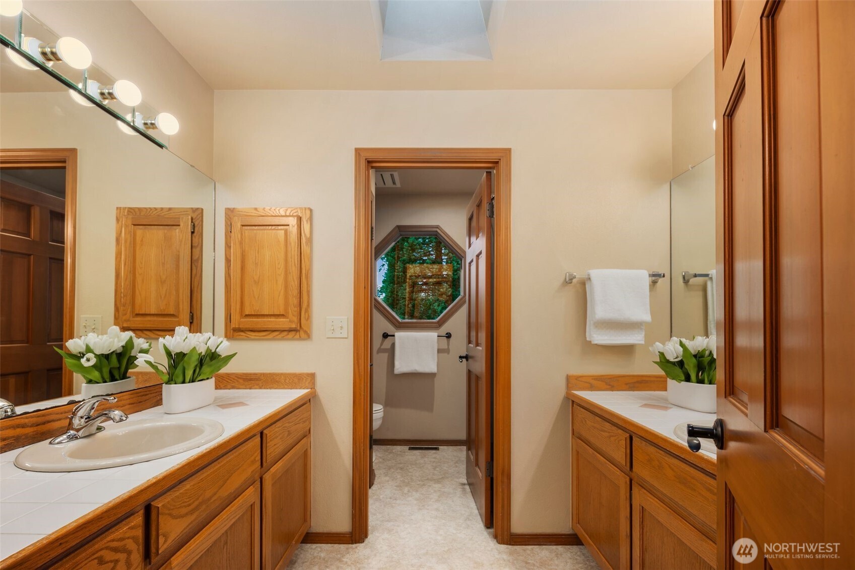 Hallway Full bath with Dual Vanity and separate bath/toilet area
