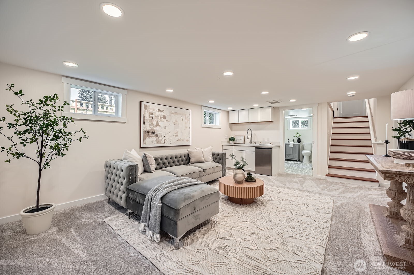 Make entertaining a breeze with your lower level that offers plenty of space with new wet bar and a quartz countertop!