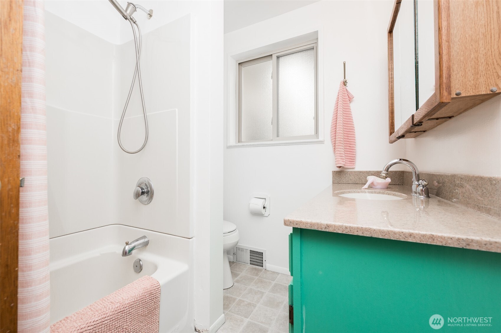 Full bath with newer light fixture and counters