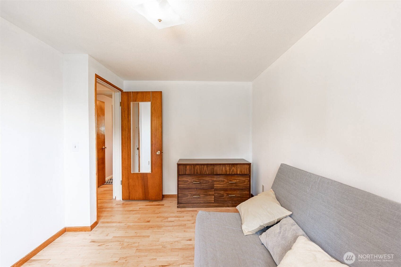 One of the guest bedrooms of the 2 guest rooms. Hardwoods throughout
