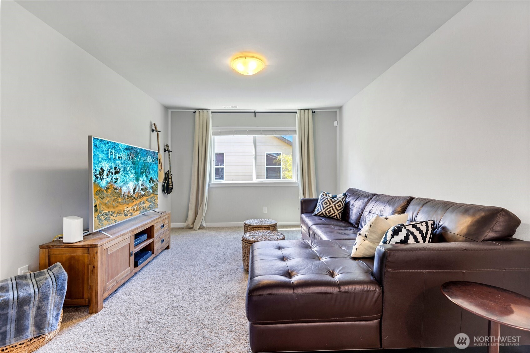 A spacious upstairs family room provides a flexible second living area—ideal for family gatherings, media time, or a quiet retreat away from the main living spaces.
