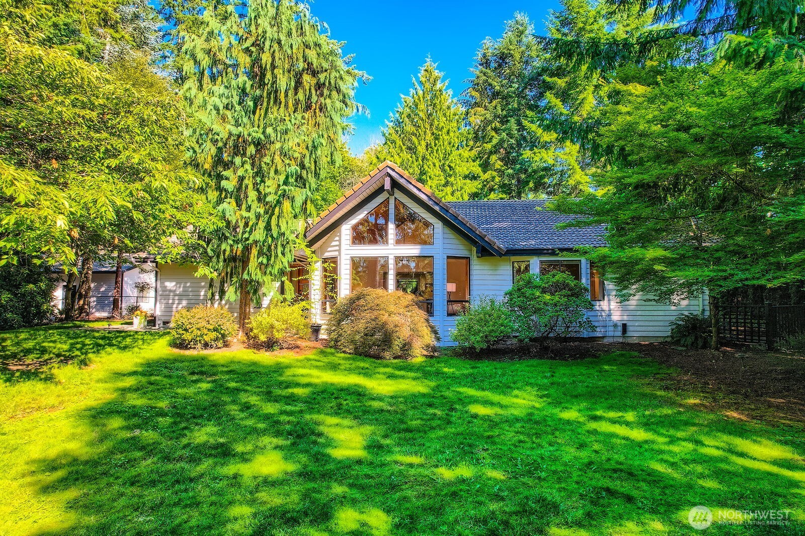Lovely dappled sunlight showcases this front yard!