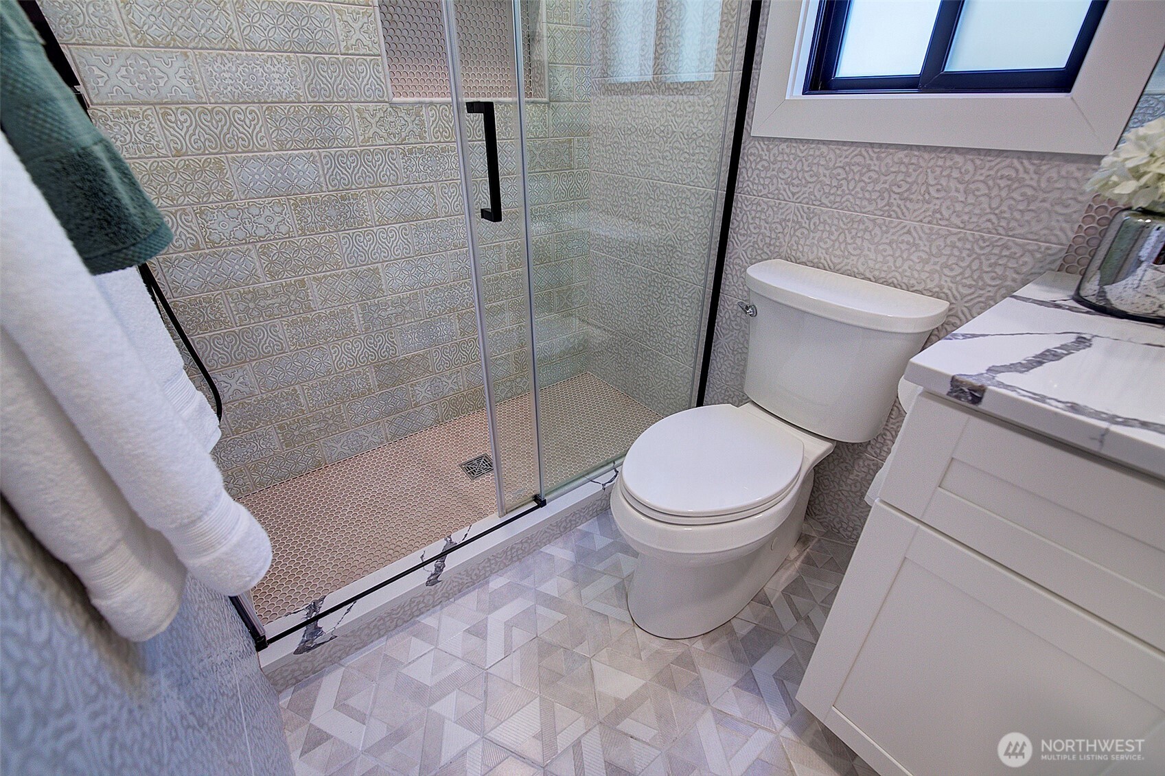Main floor guest bath with designer finishes