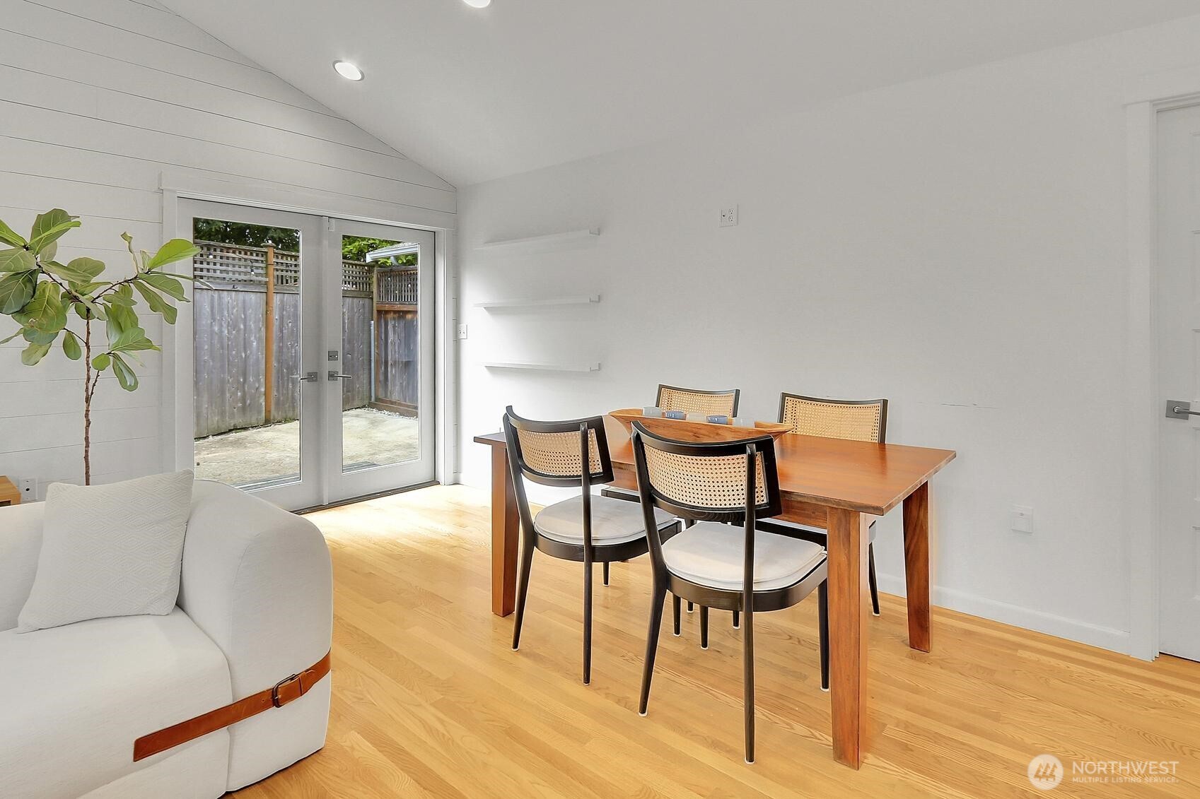 Outside the French doors is the newly concrete side yard