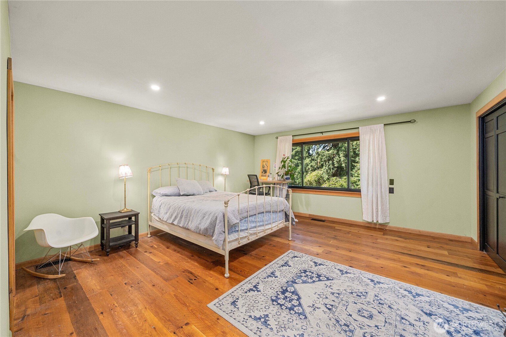 The door leads to the covered portico and to the garage.