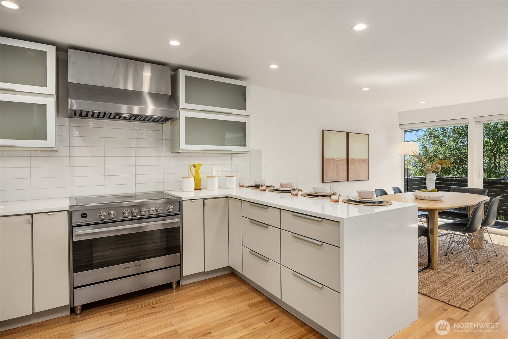 The large island comfortably seats up to four and features clean lines and plenty of storage.
