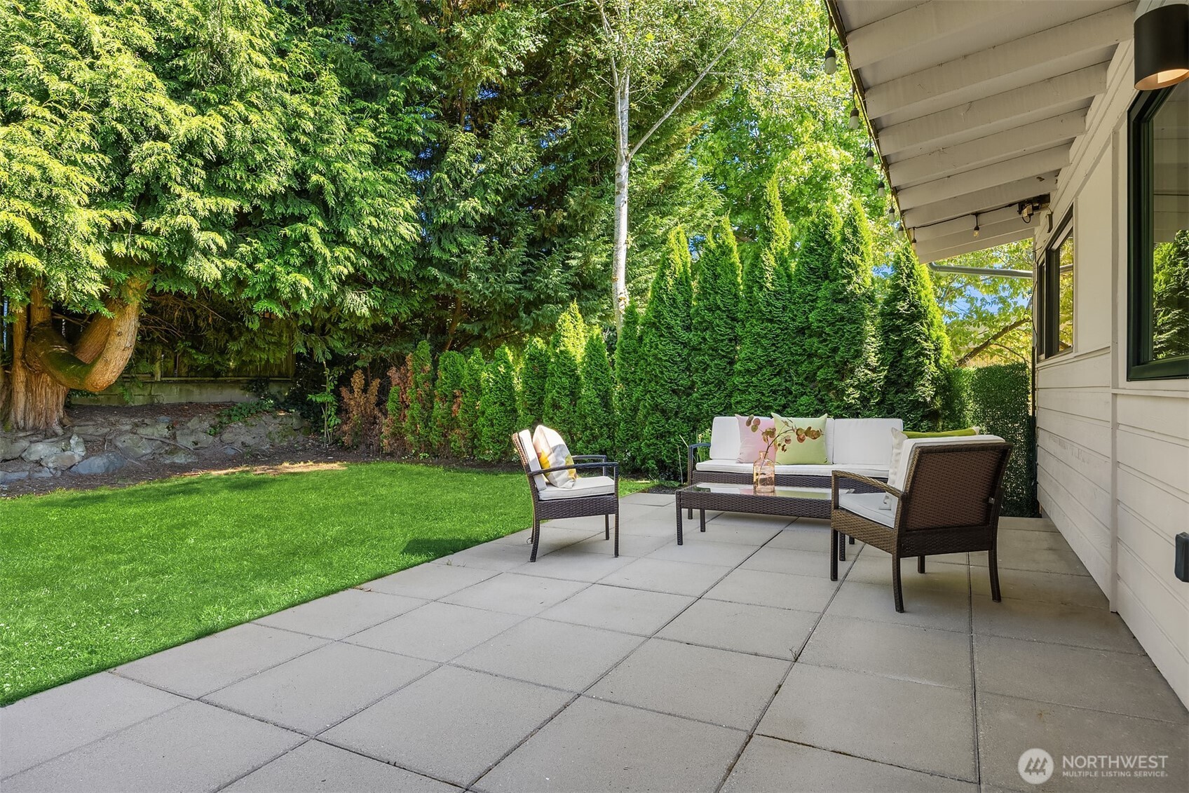 The spacious patio offers plenty of room for both a lounge area and a dining table that seats up to 20—perfect for hosting large gatherings!