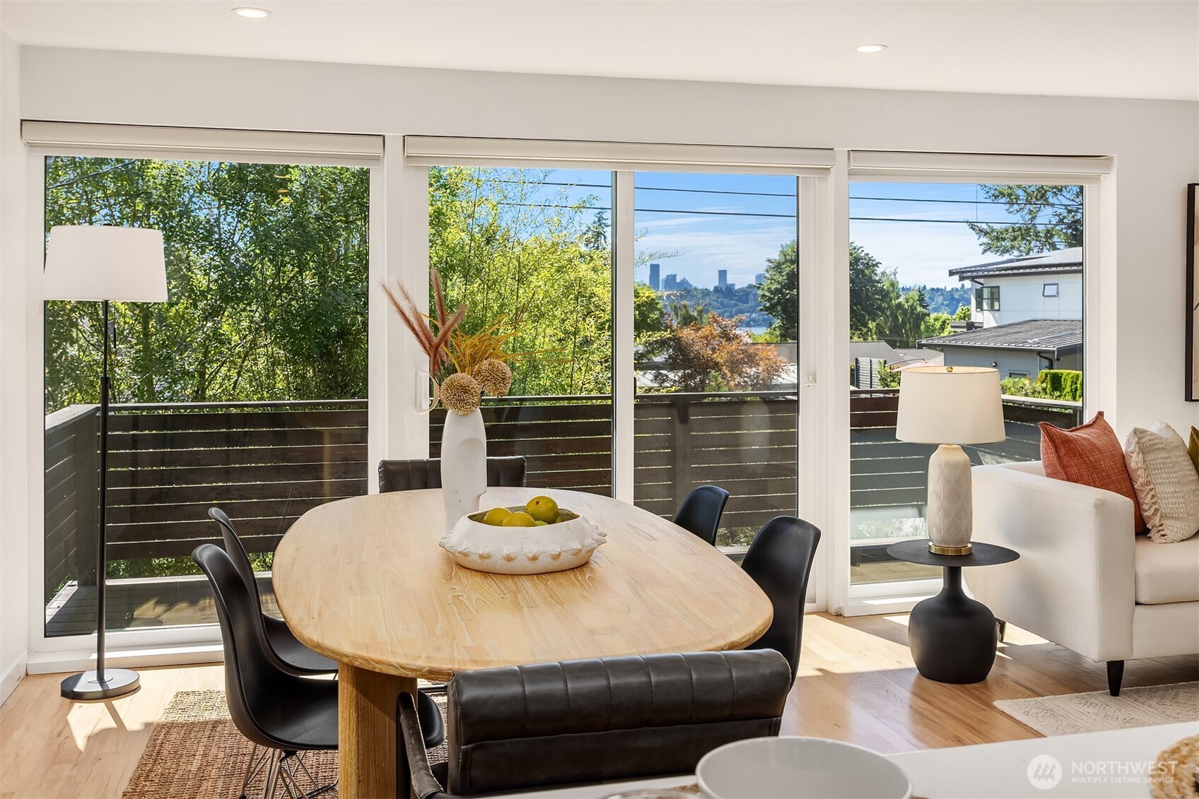 The open-concept layout offers effortless flow from the kitchen to the living and dining areas, creating the perfect space for entertaining and everyday living.
