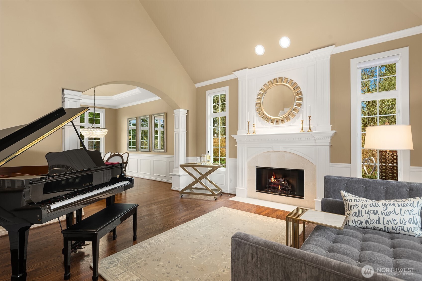 Enter to a grand, light-filled foyer that reveals a signature statement in craftsmanship of this lauded, premier Northwest Builder ~ beautifully detailed crown moldings, coffered ceilings, chair rail, wrapped windows, extensive built-ins and quality trim finishes providing warmth and sophistication.