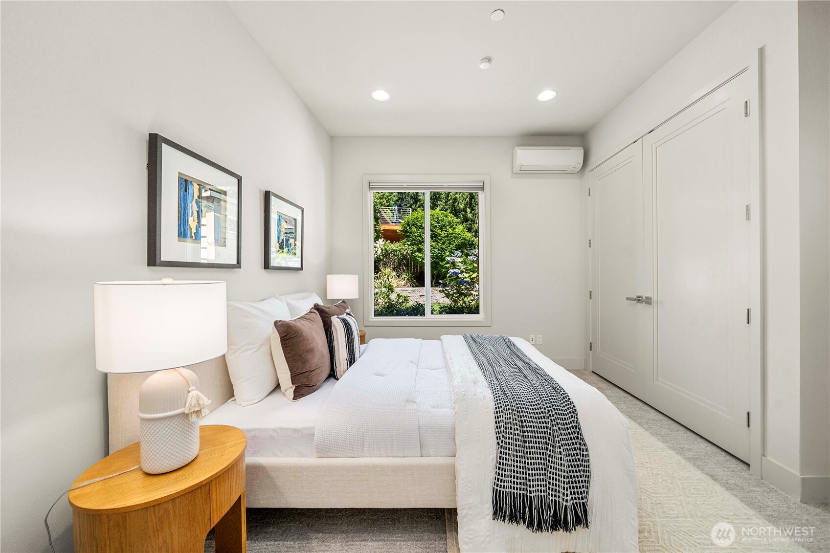 A versatile second bedroom or den on the main level offers the perfect space for guests, a home office, or multi-generational living—conveniently located next to a full bath.
