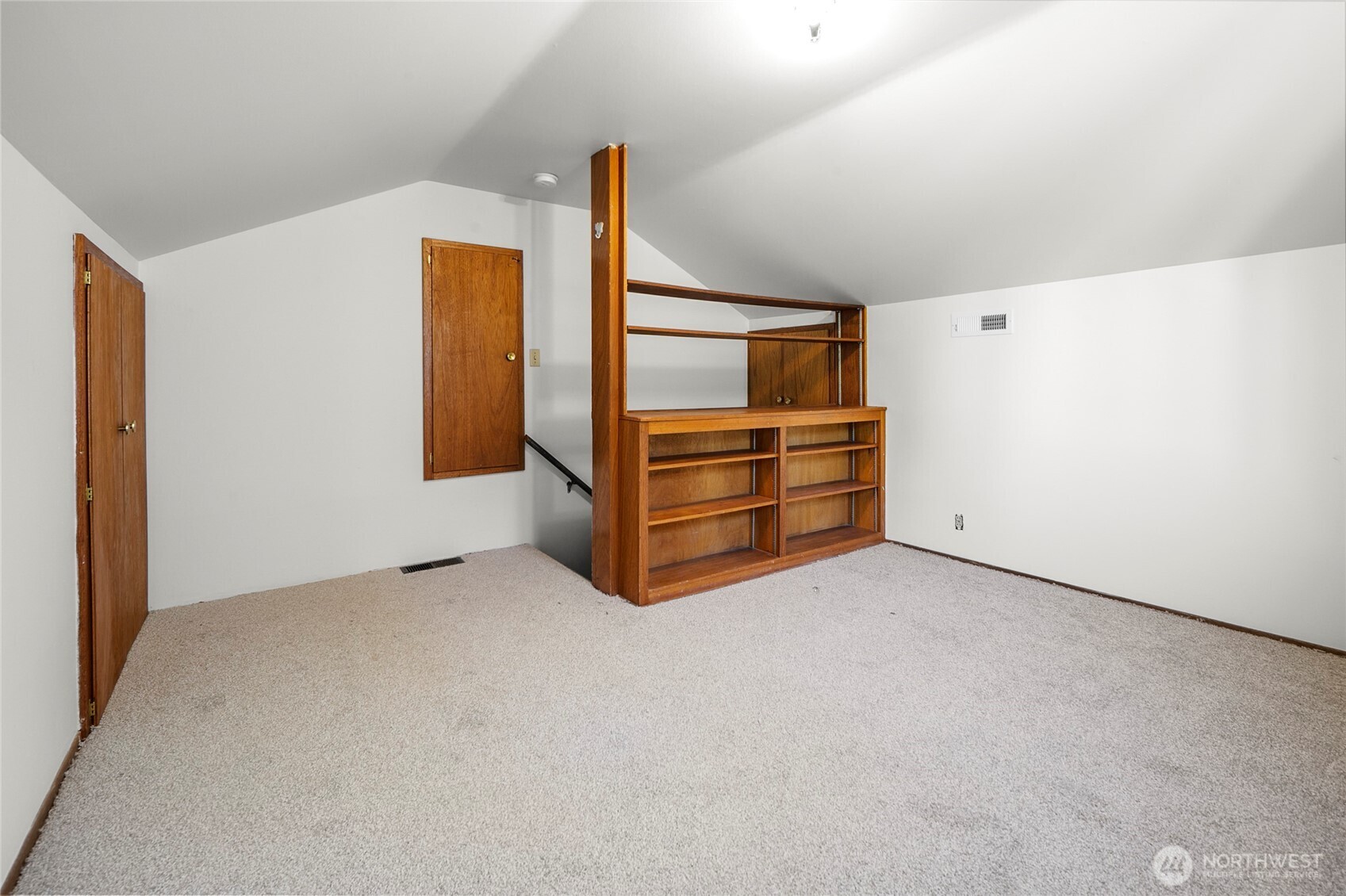 built-ins make the loft a practical extension of the home—perfect for books, games, or staying organized.
