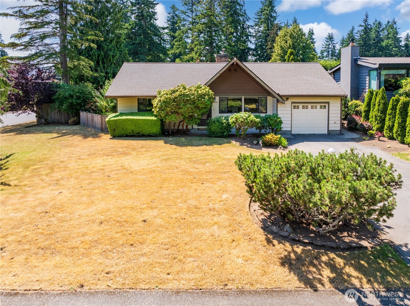 Perfectly perched on a sun-drenched corner lot with mature landscaping and timeless curb appeal.