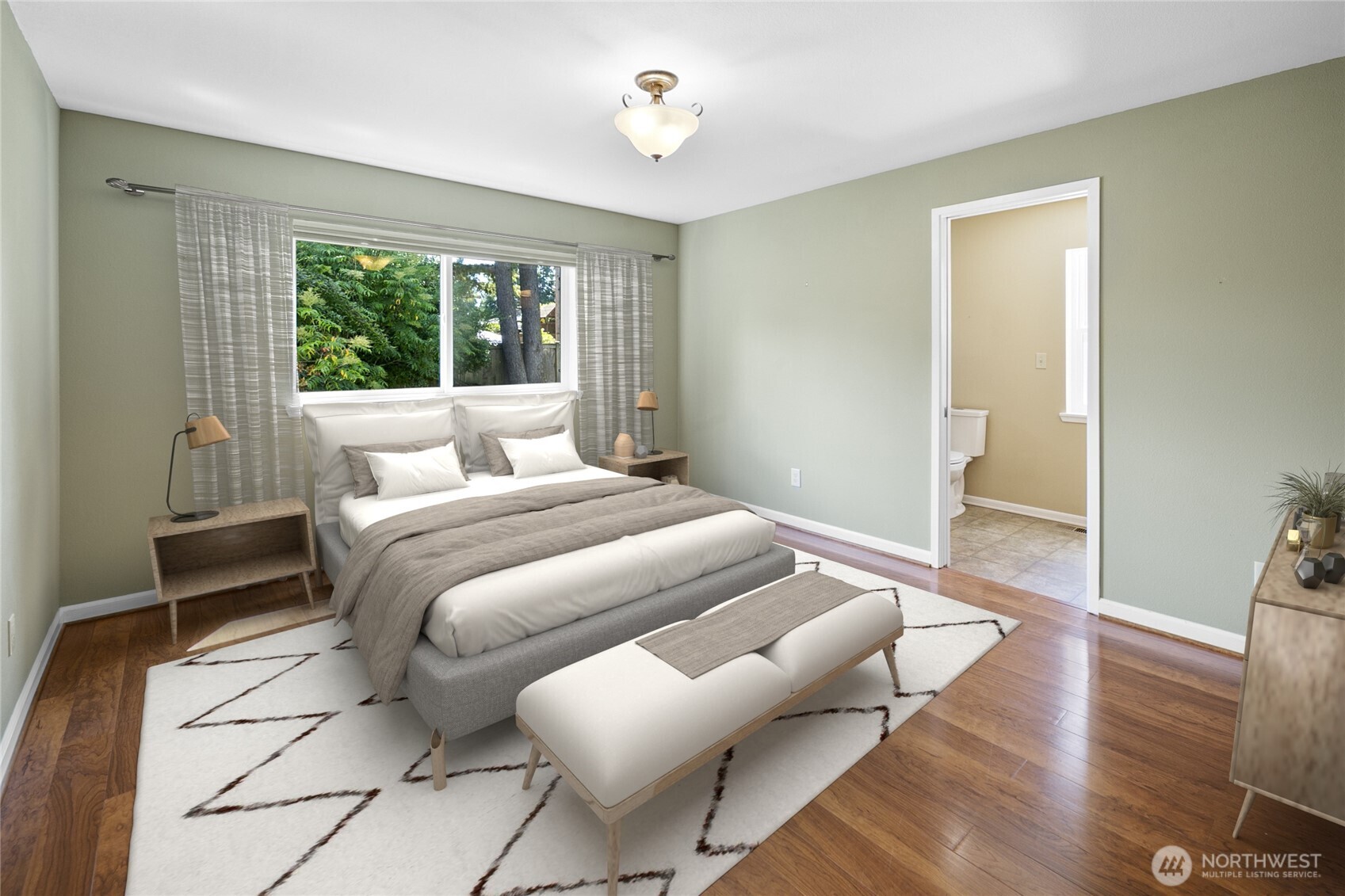 Retreat to the primary suite: a quiet sanctuary tucked away from the main living areas. Home is virtually staged.
