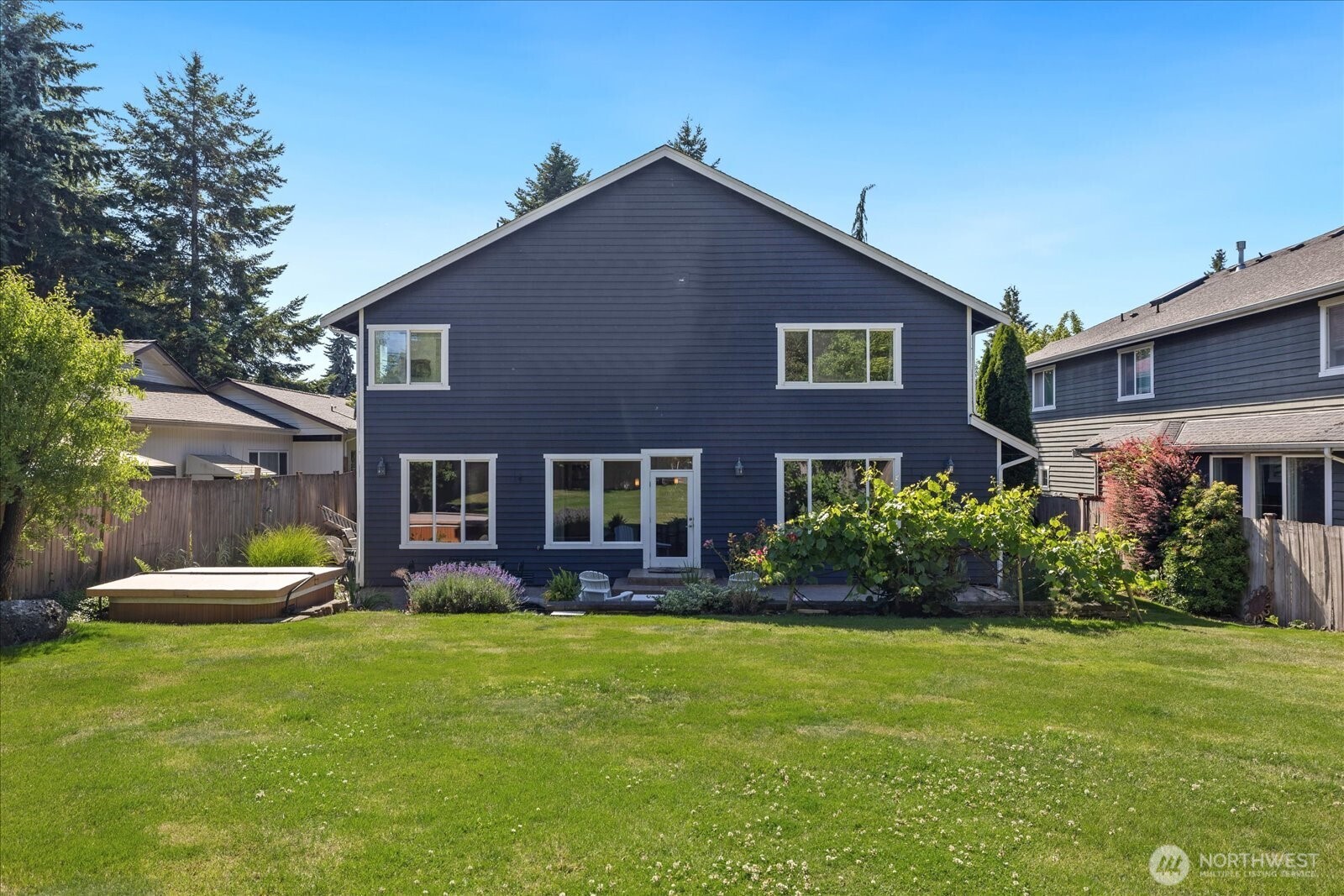 Imagine romping around on this large, flat, fully fenced yard!