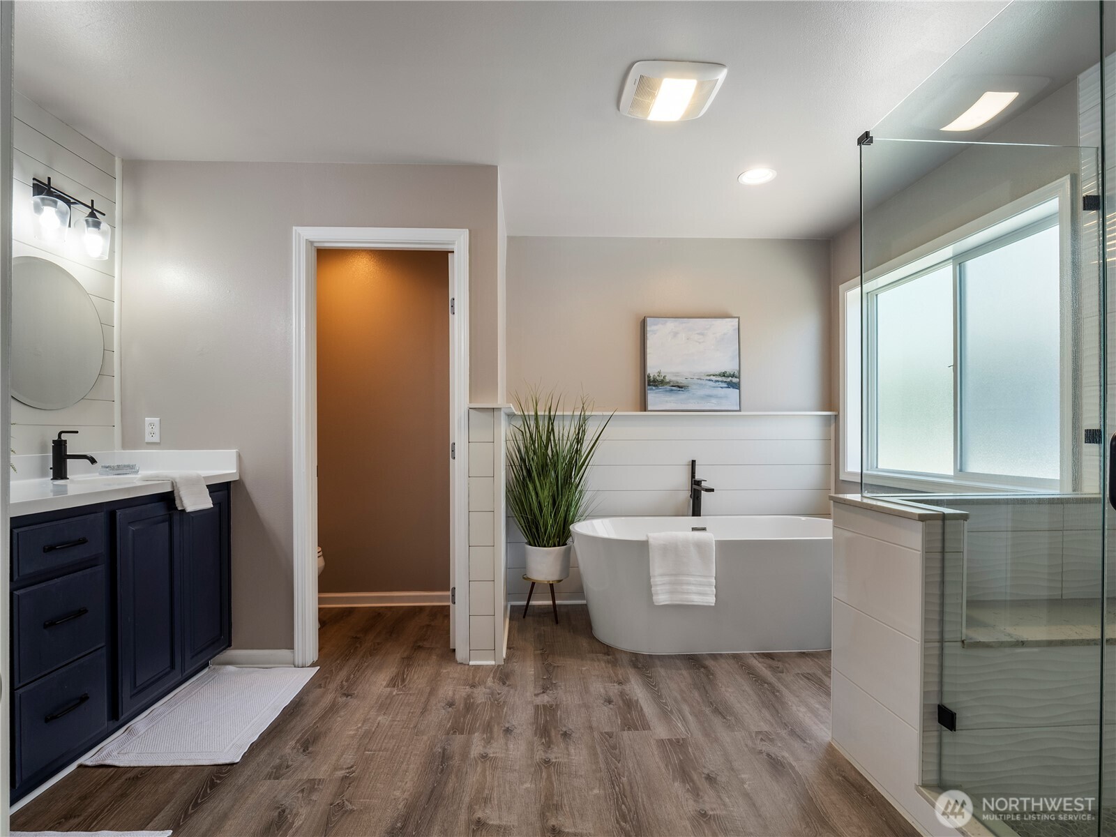 The primary bathroom was beautifully updated in 2022.
