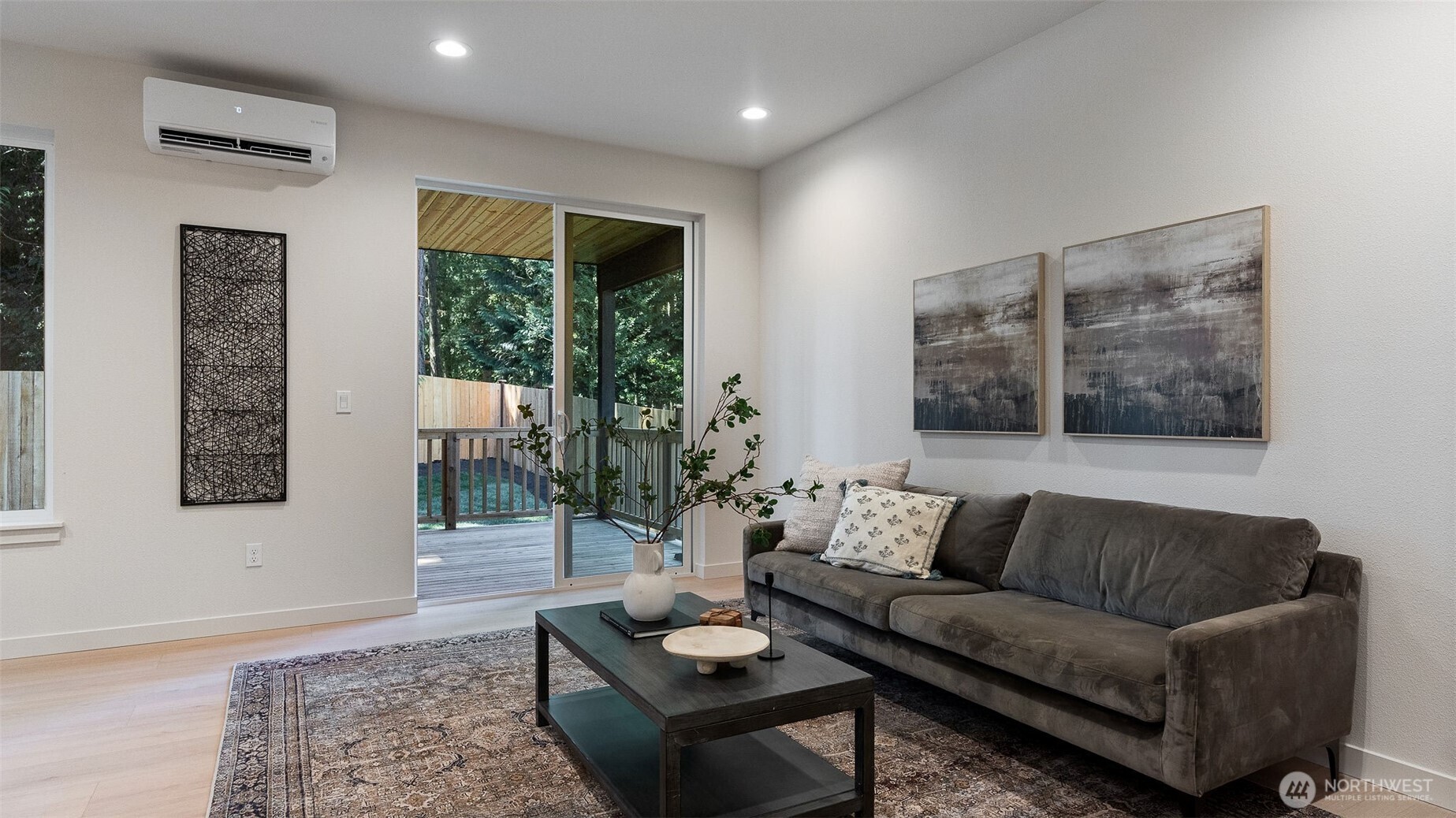 Great room has access to covered deck and back yard