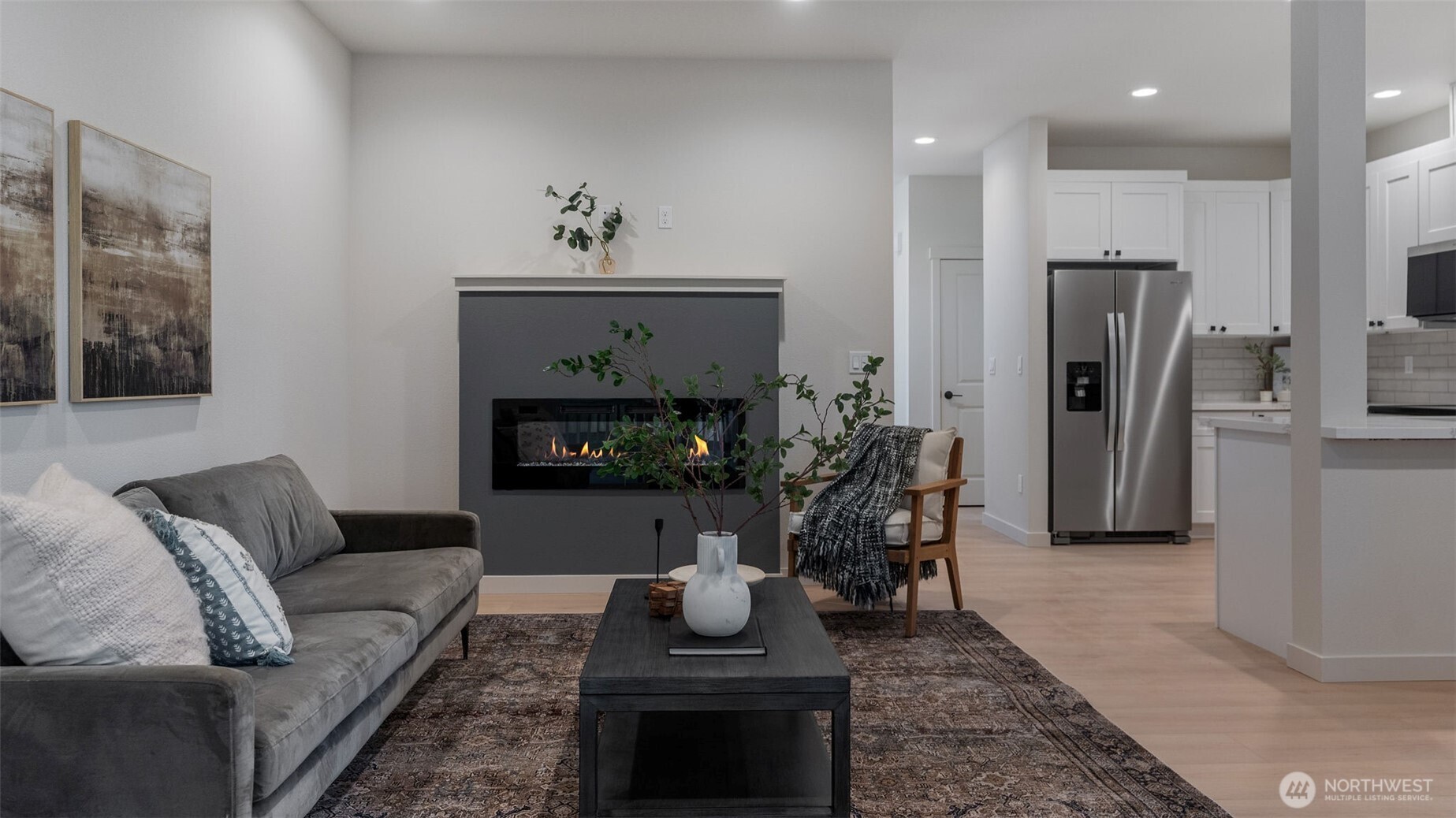 Great room has cozy fireplace.