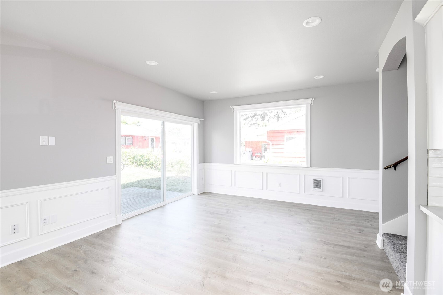 Large Great Room off kitchen with room for sofa's, chairs & dining set.Custom 9' Sliding Glass Door leading to deck & fenced back yard.