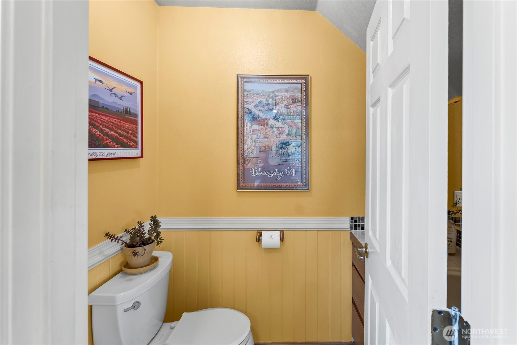 1/2 bath is located off the kitchen.