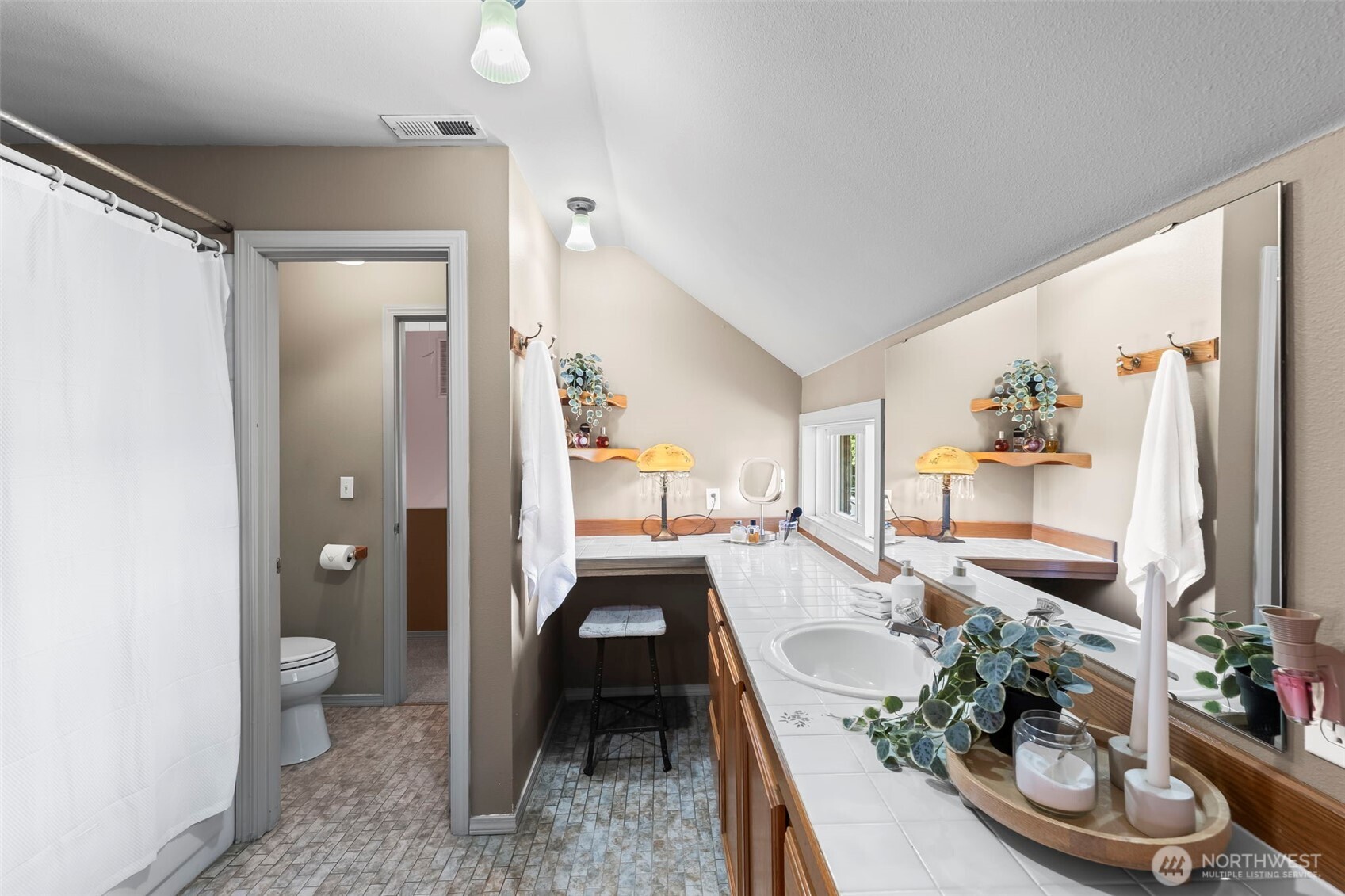 Primary en-suite has plenty of counter space and natural light
