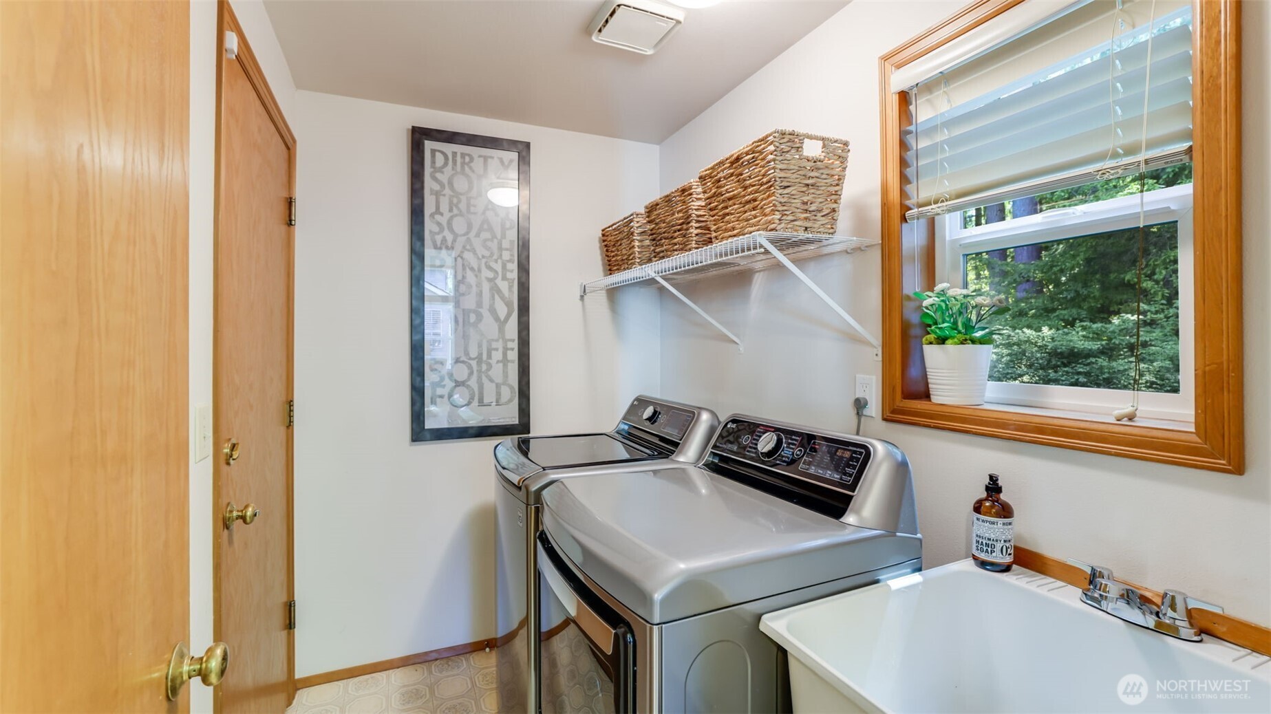 The laundry room has a washer and dryer (that remains) and a deep sink.  .  The laundry is just off the kitchen.  There is a deep sink that remains with the home.  The washer and dryer als stays with the home.