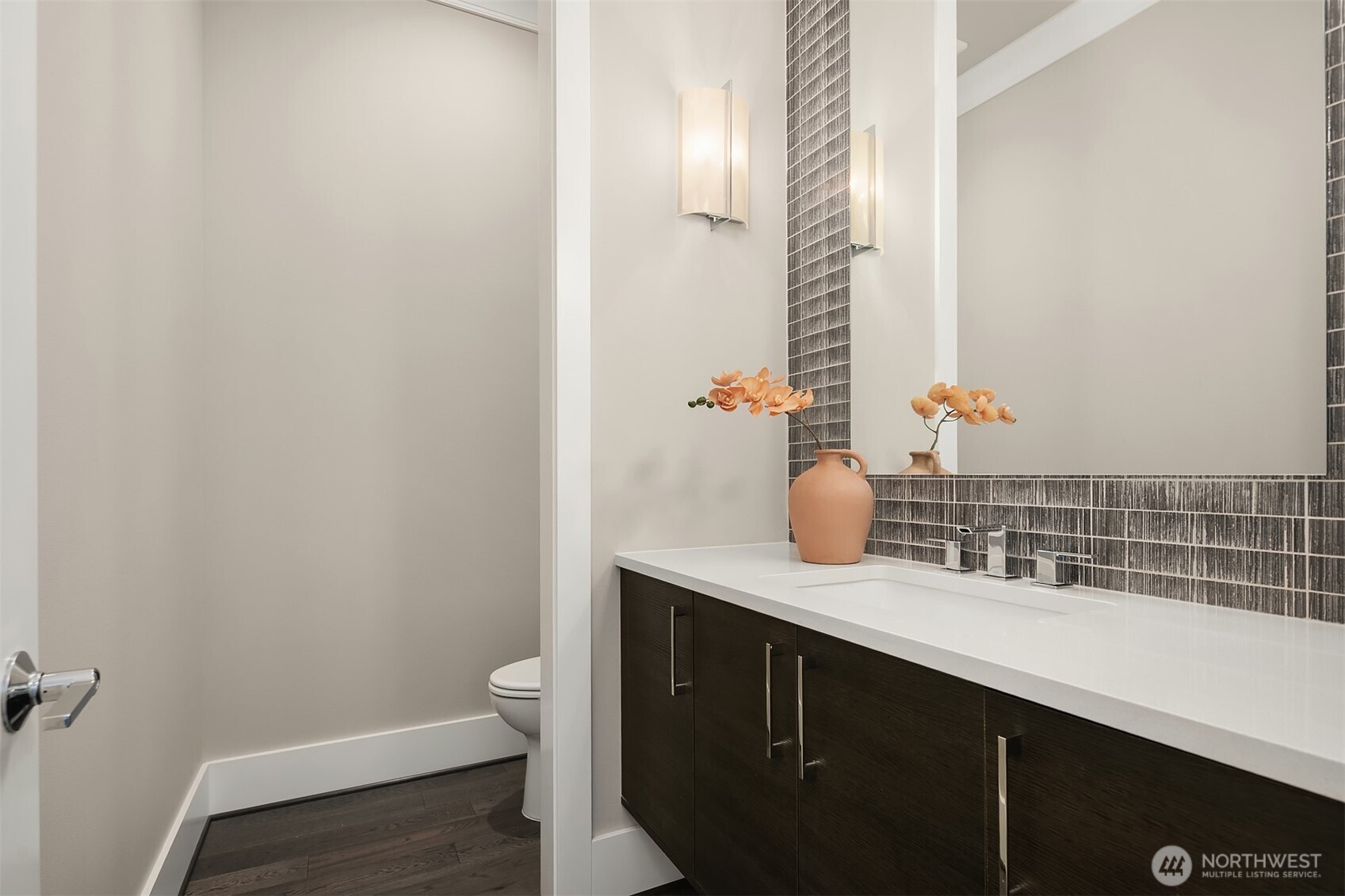 Convenient powder room off the foyer.