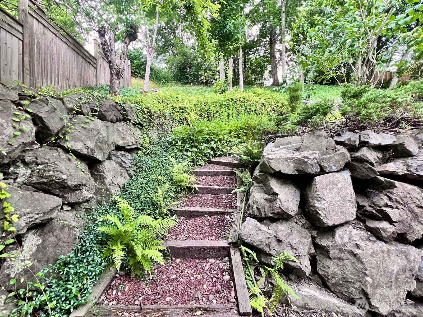 Built in walkways to access upper tiers of backyard from the south side of the home.
