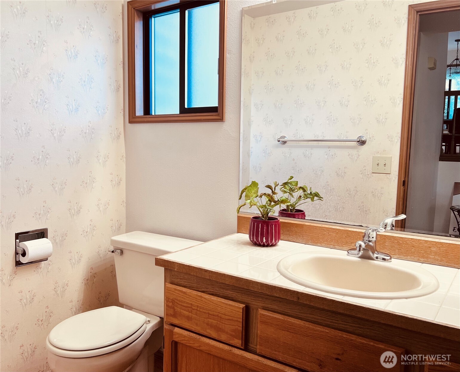 Front large size powder room by foyer entrance.