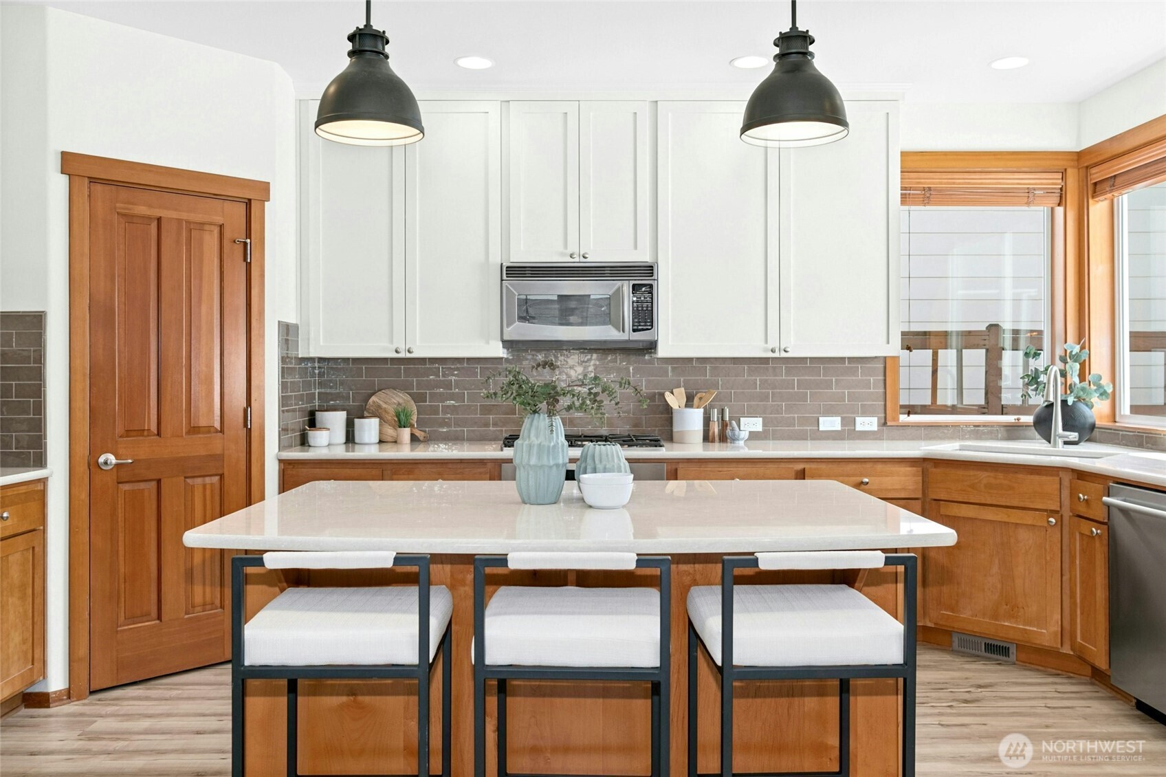 Perfect amount of space for a large island and seating for guests or the homework crew to hang while you cook.