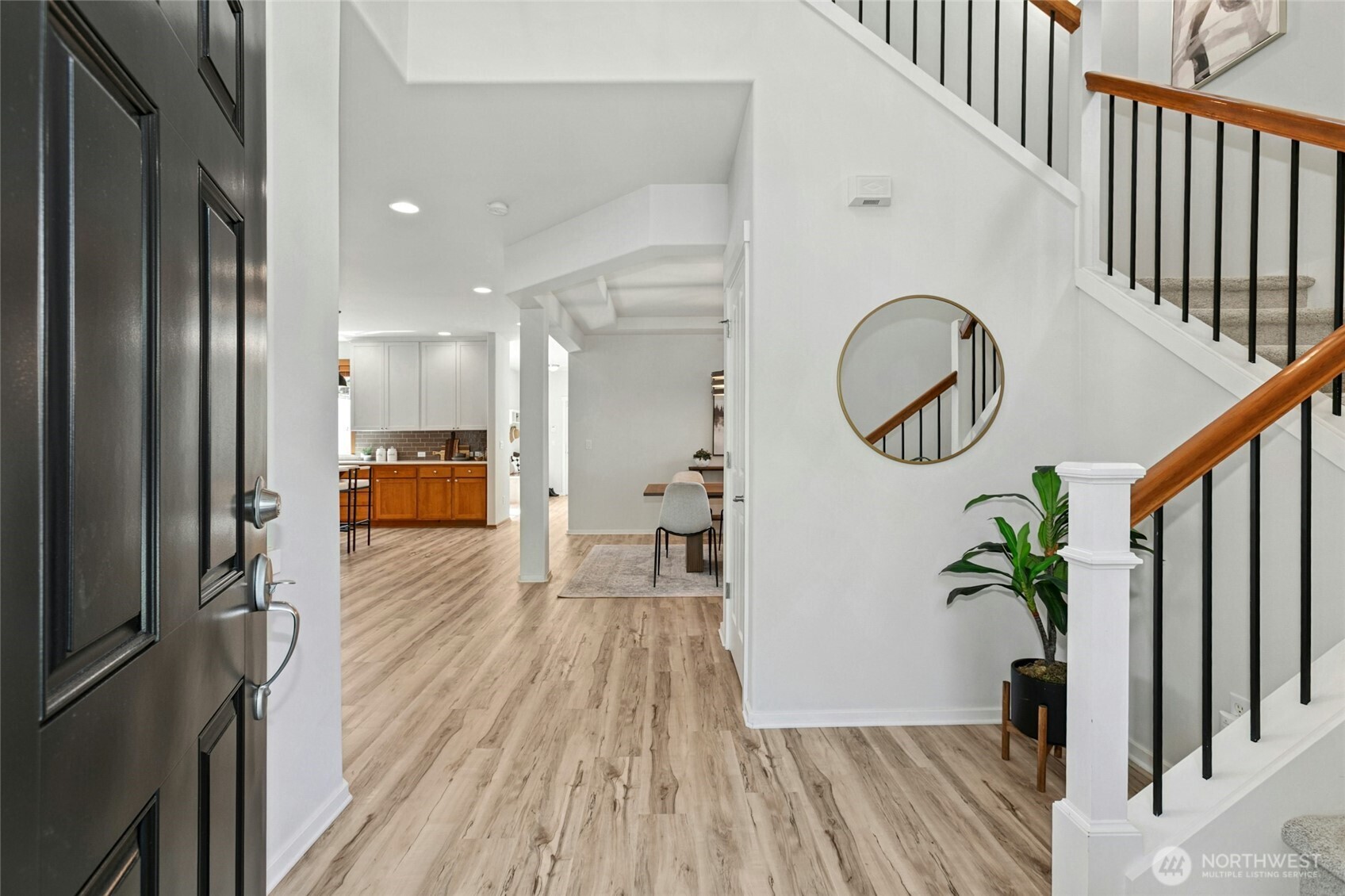 Welcome! To a huge entry, coat closet, views to the open floorplan and soaring vaulted ceilings