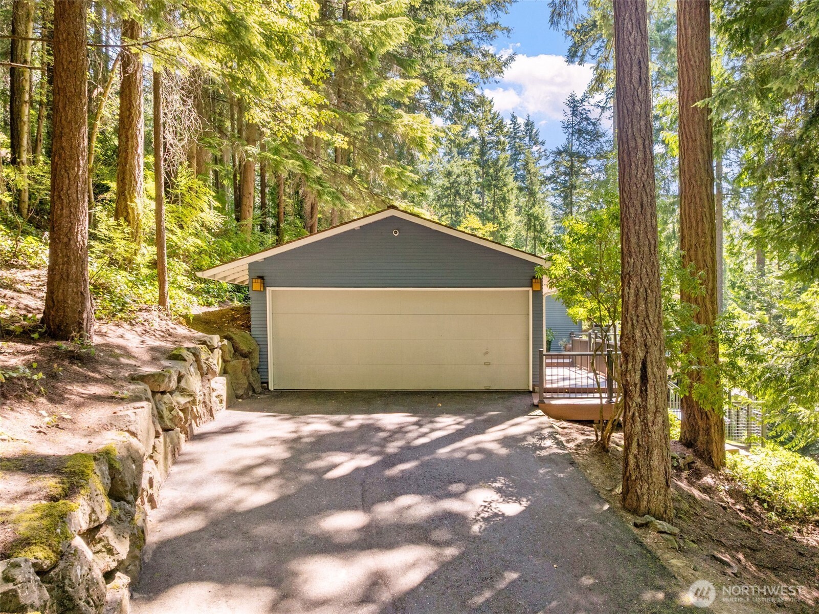 Conveniently located at the front of the property, the detached 1-car garage provides additional parking, storage, or workshop potential.
