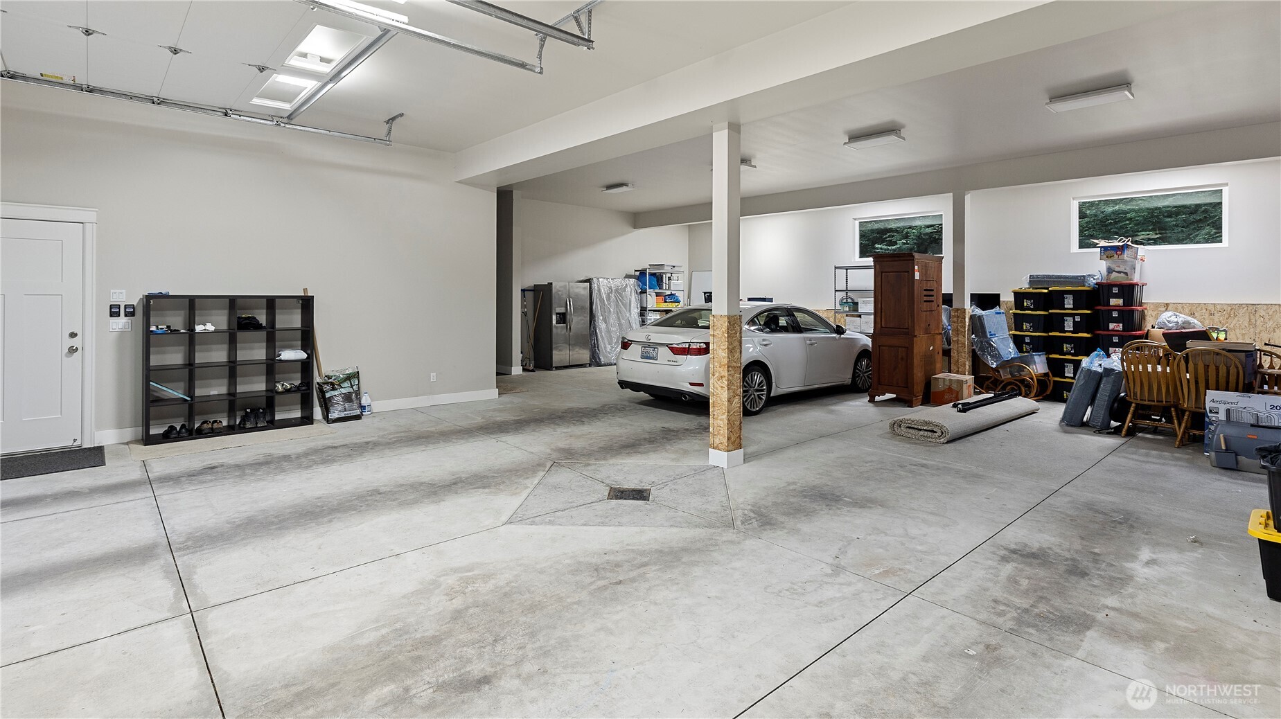 This is just one side of the garages. Also a HALF Bath not shown. Other side has the Built in Storage and room for Covered RV, Boat, Trailer or more Cars!! Or Just a HUGE SHOP!!