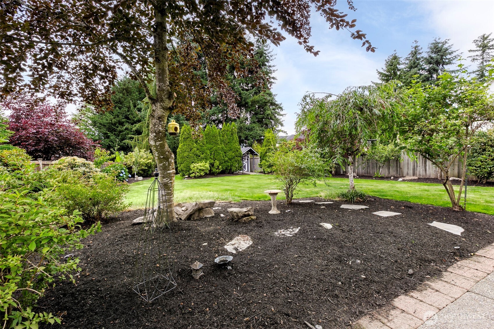 Step outside & marvel at your backyard size, functionality & privacy. Curated & strategically planted trees & shrubs--yes that is a barn/shop--She Shed and/or Man cave w/ 2 entrances.