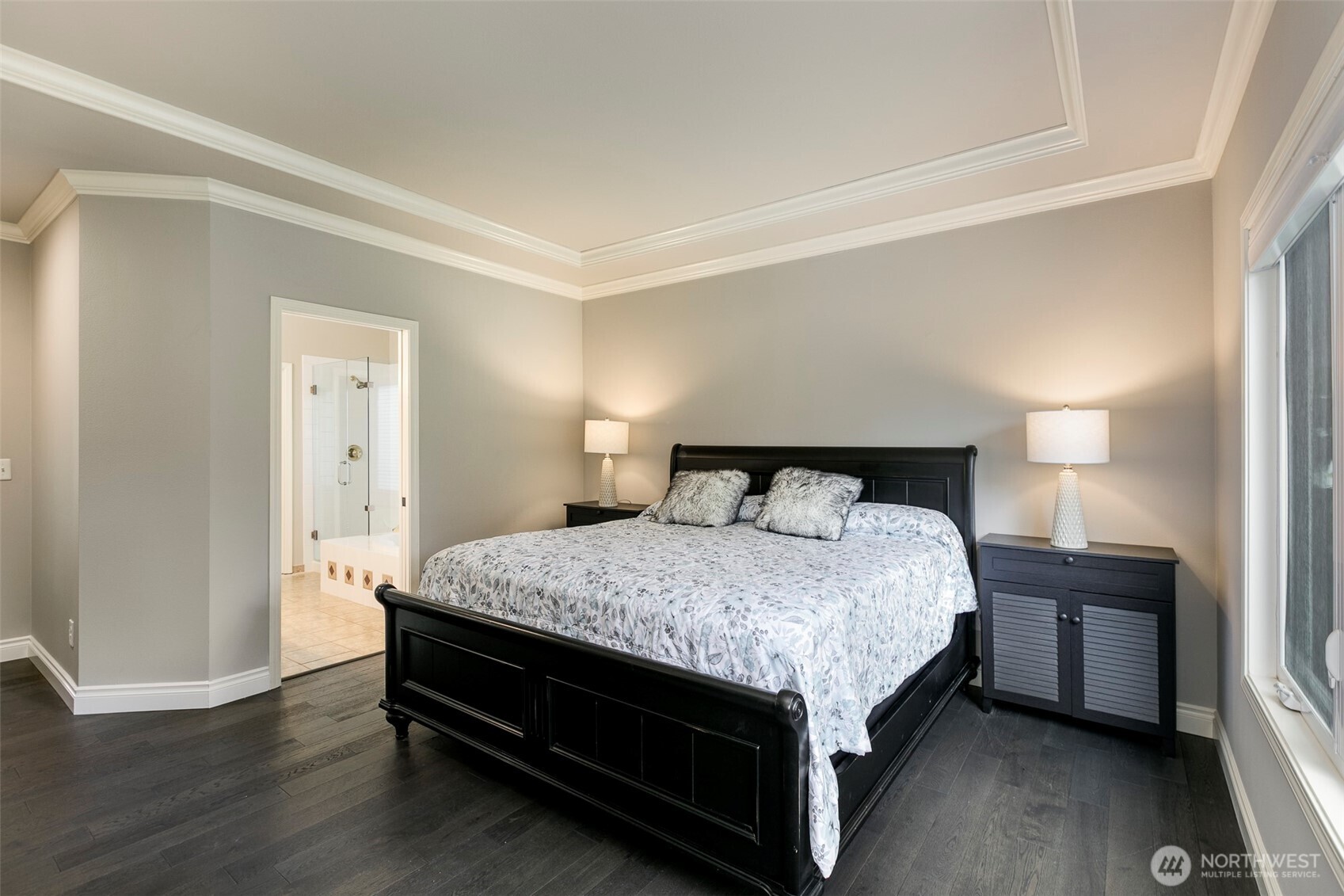 Large suite is set off private hallway. View into primary bath