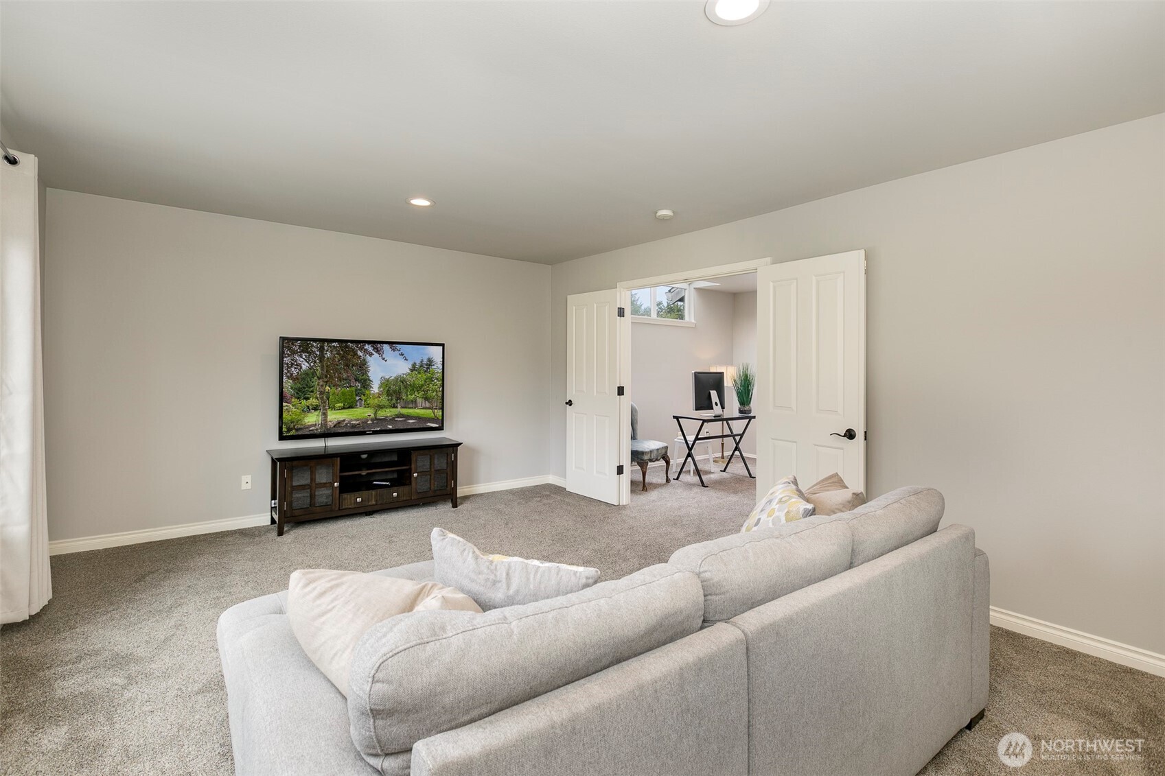 Double door entry to large bonus room off the upstairs loft