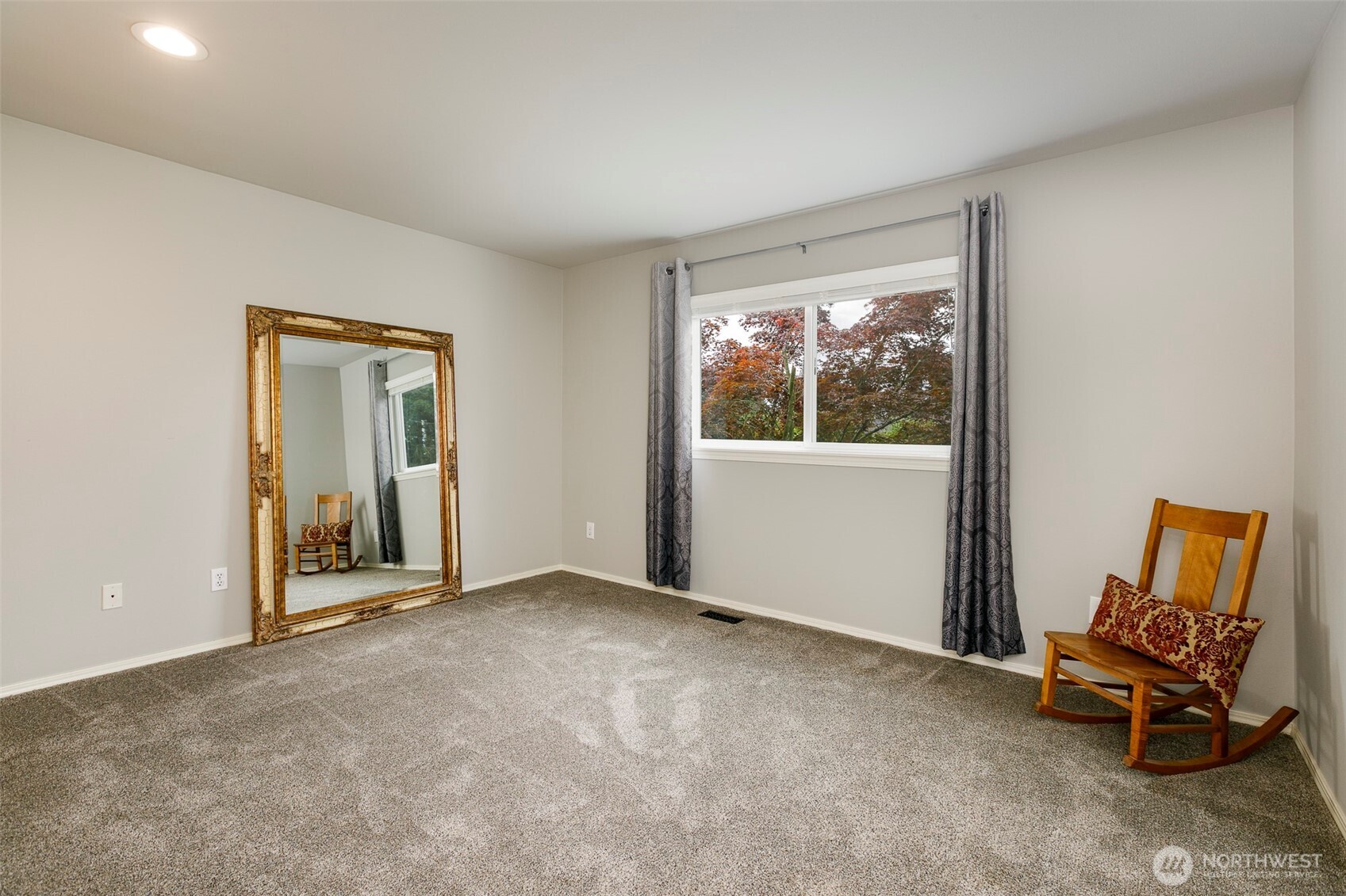 4th bedroom upstairs is quite large & enjoys backyard views