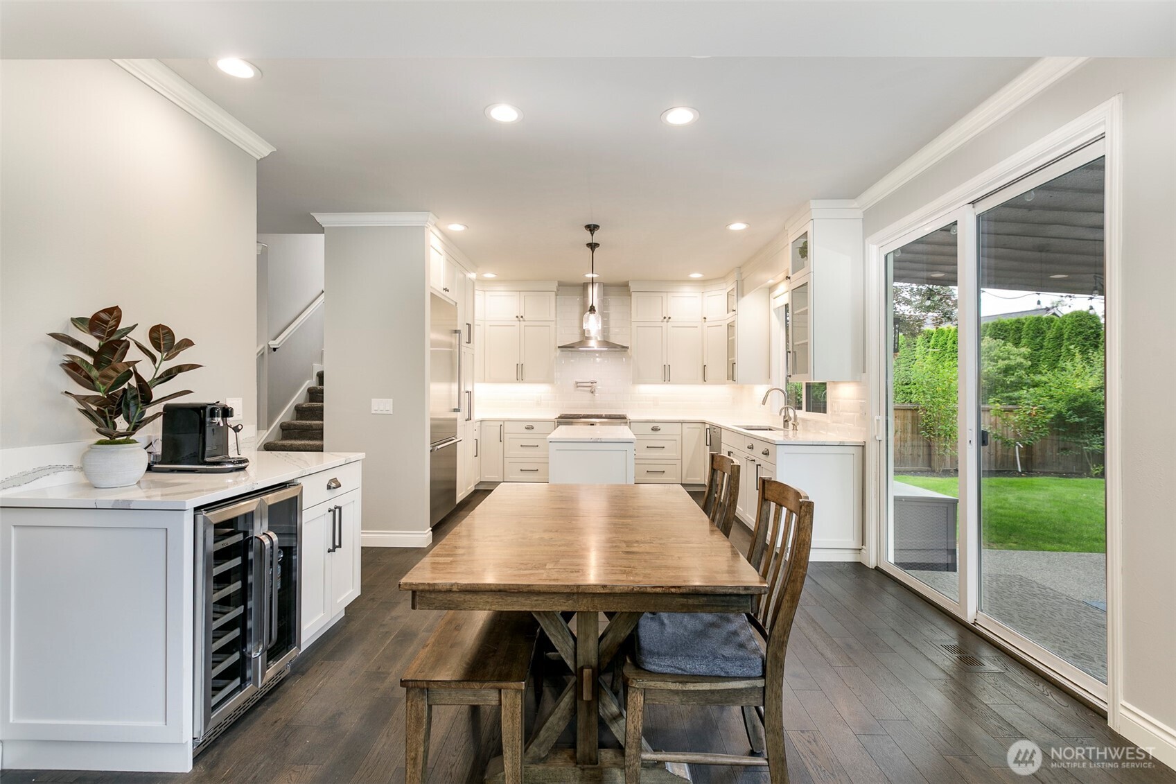 Fantastic kitchen remodel w/ huge nook area; wine bar & 8' slider leads out to backyard