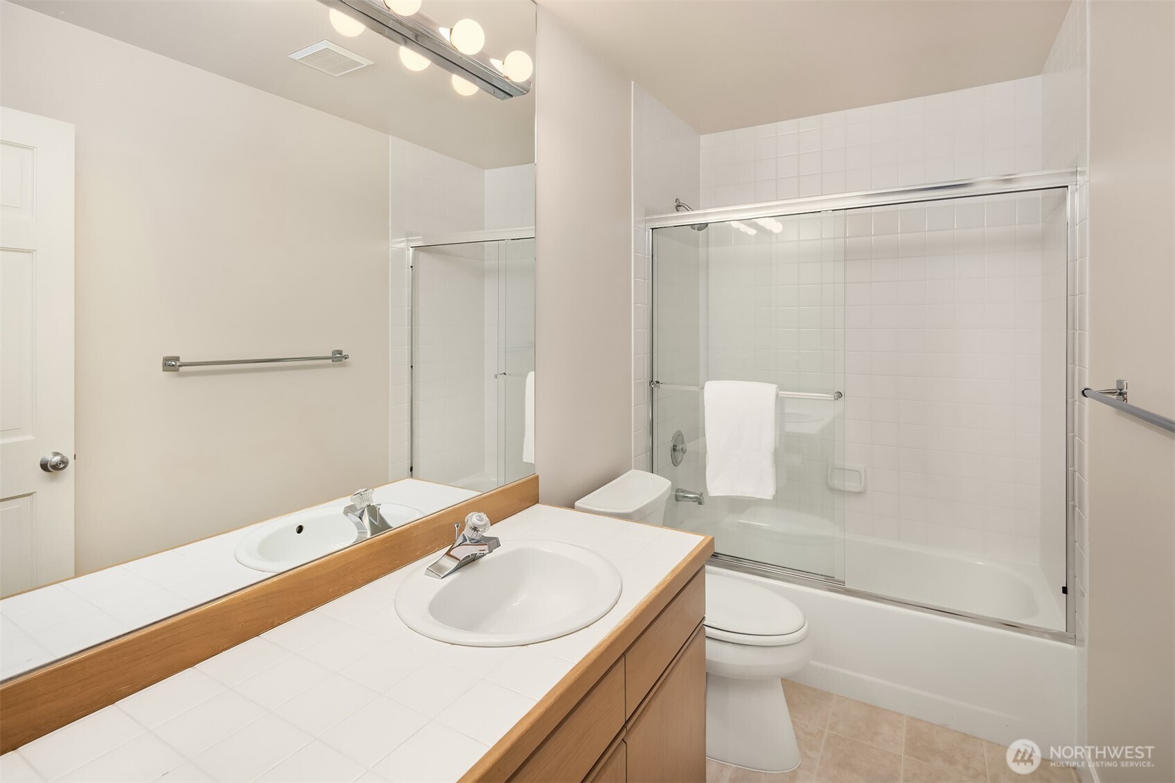 Full bathroom outside second bedroom.
