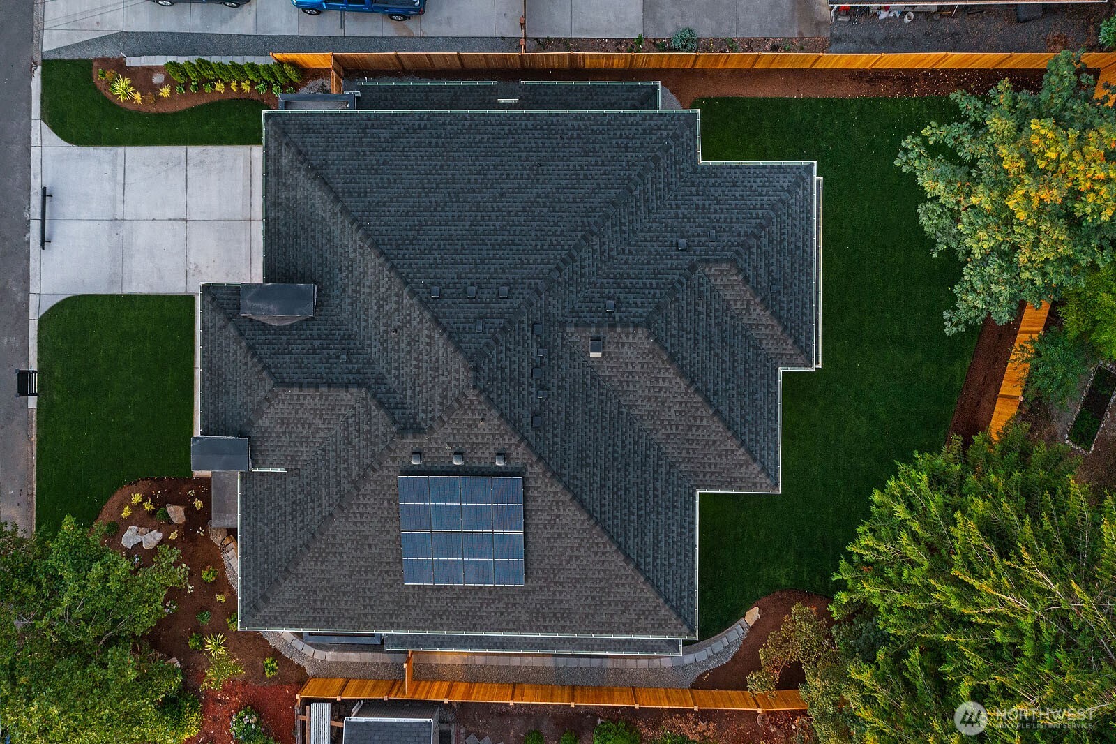 This home contains solar panels. The photo shown above is from a different MN Custom home with a similar solar array.