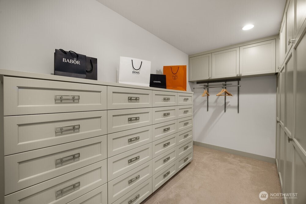 Large walk-in closet in primary bedroom suite.
