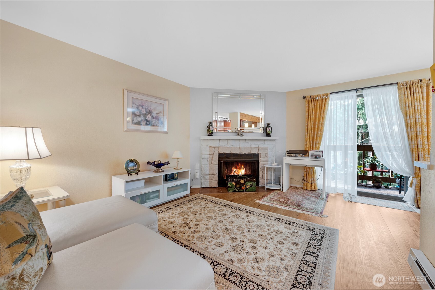 Spacious living room with a wood burning fireplace
