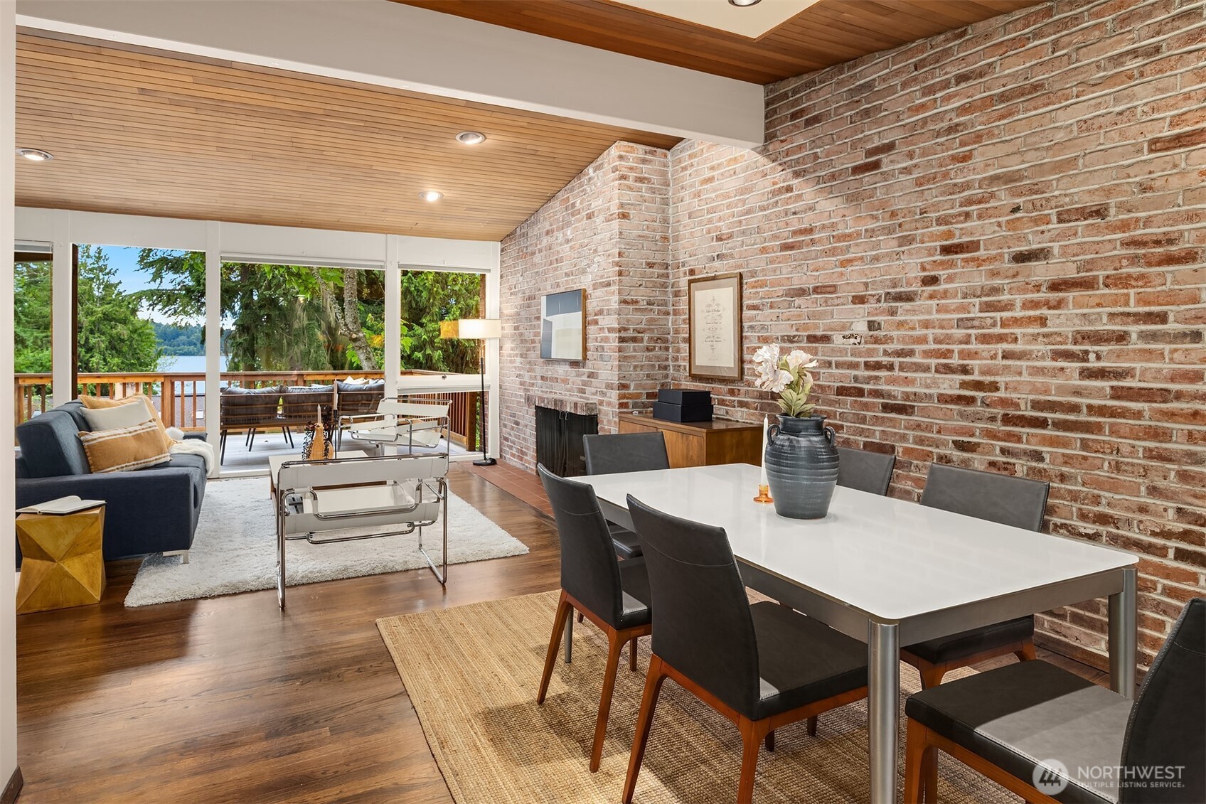 Floor-to-ceiling windows on both the east and west sides flood the living and dining areas with natural light from dawn to dusk.