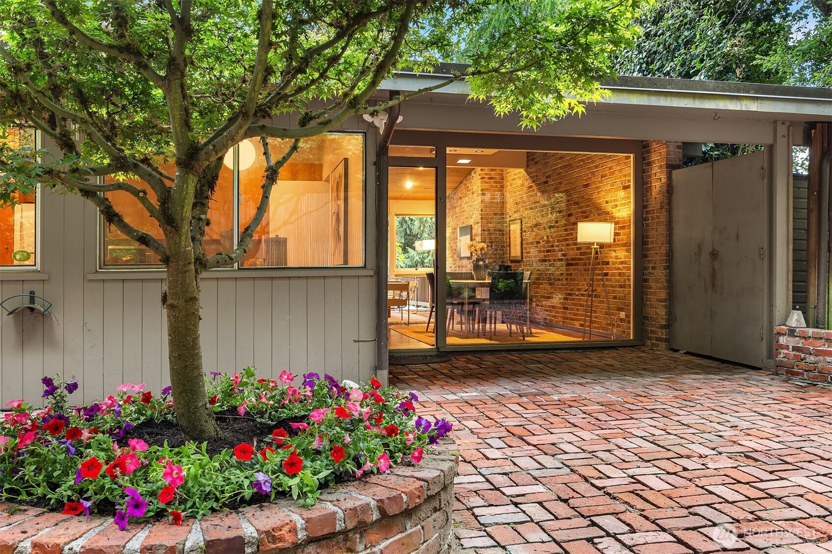 Step out from the formal dining room onto the brick patio and relax beneath the shade of a mature maple tree.