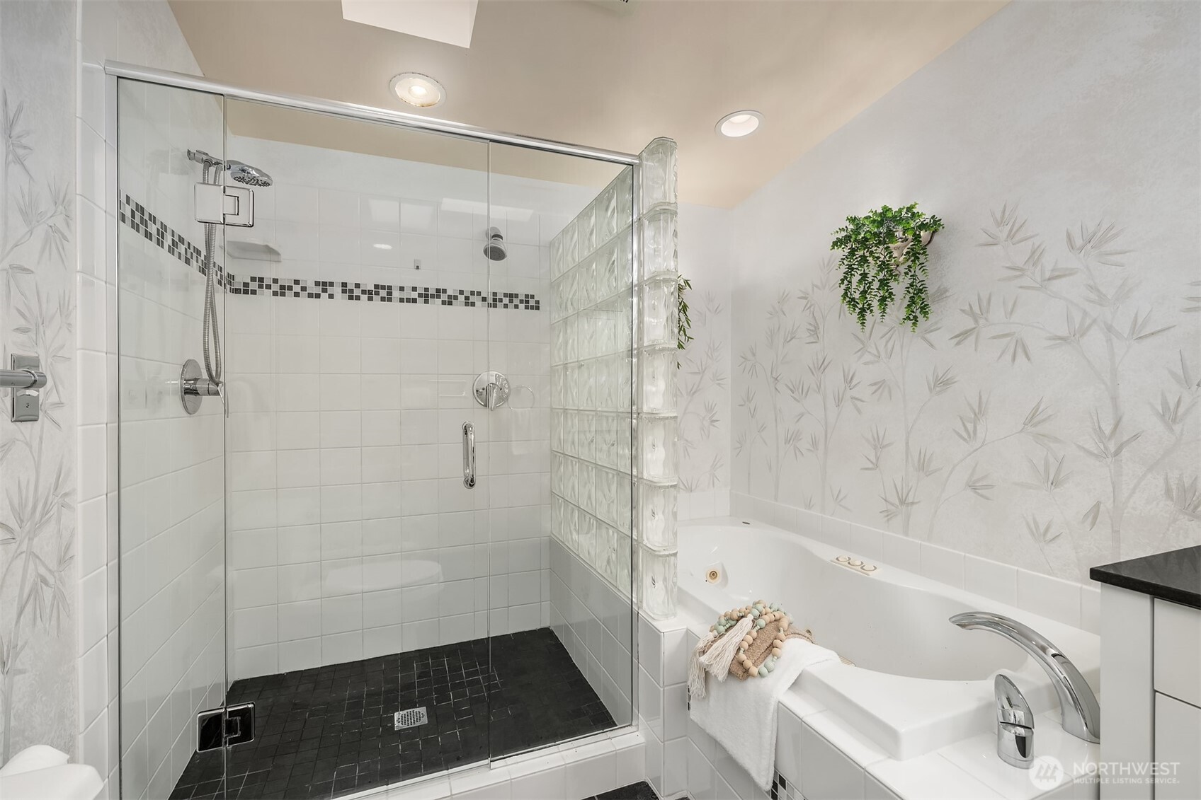 Updated bathroom includes both a walk-in shower and a spa-like jetted tub for the best of both worlds.