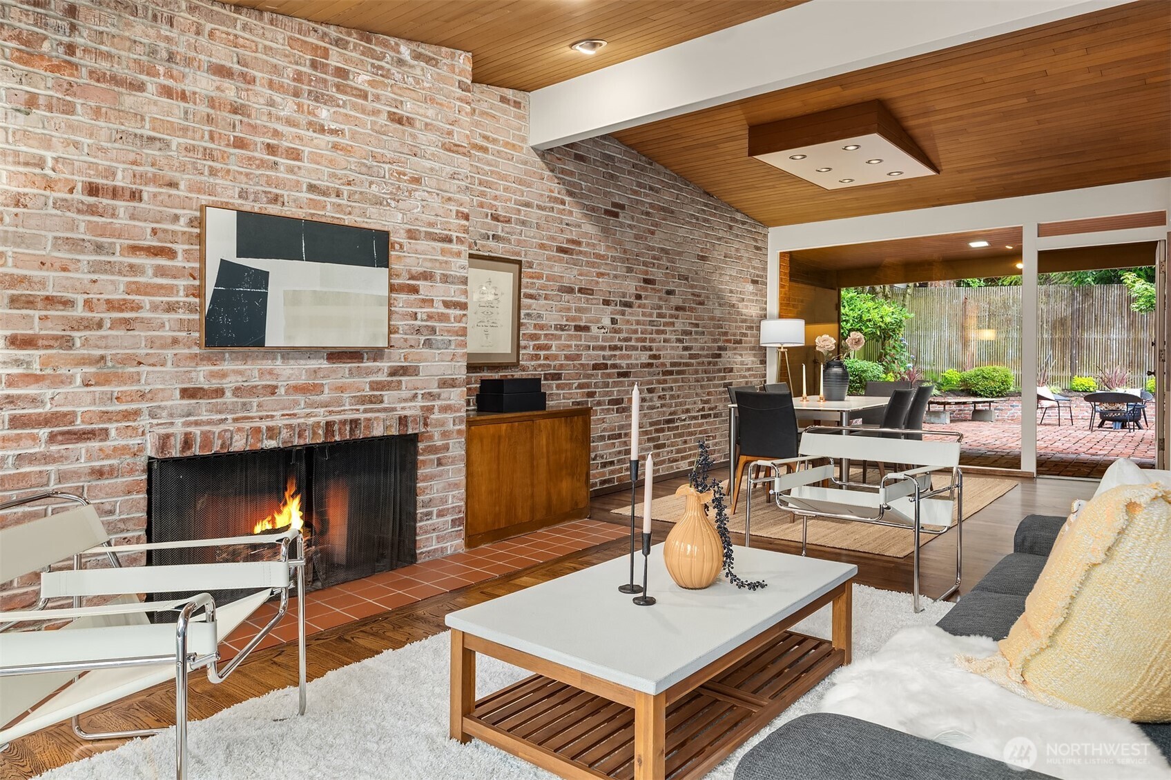 The wood-burning fireplace sets the stage for cozy evenings—whether relaxing with loved ones or entertaining guests.